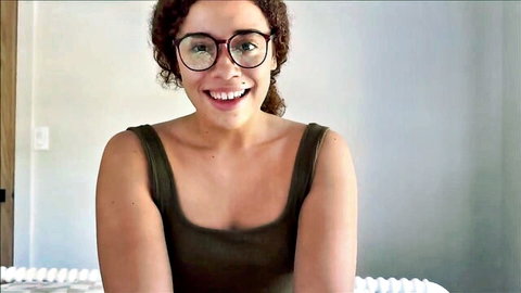 Shy ebony step sister with curly hair and glasses smiling in tank top, craving deep anal