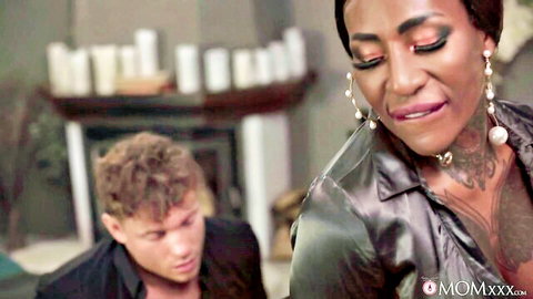 Beautiful black stepmom in shiny top seducing stepson closeup