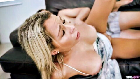 Tanned blonde MILF with big natural tits gets pussy eaten by young guy on couch