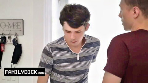 Pale young stepbrothers stand close in home eyeing each other clothed gay tease