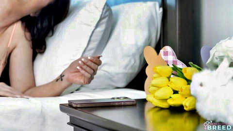 Asian MILF in bed with Easter bunny and tulips, teasing for breeding in Mom Lover series
