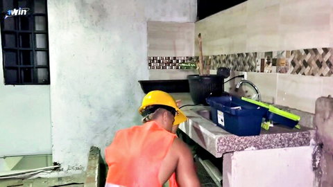 Shirtless builder Milan Rodriguez bends over counter in construction site tease with Silvana Lee