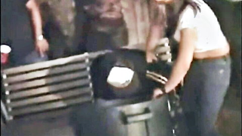 University lesbians in casual clothes near outdoor bin, teasing lesbian oral action