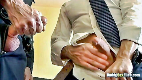Curious officer in uniform gets handjob from suited man in gay hardcore scene