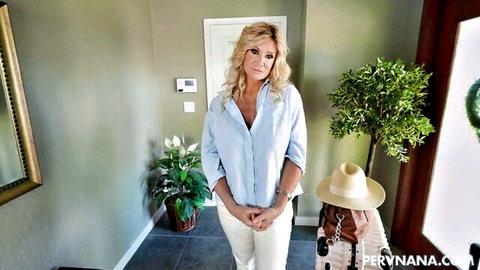 Blonde MILF in blue shirt and white pants at home for FFM cock-sharing threesome