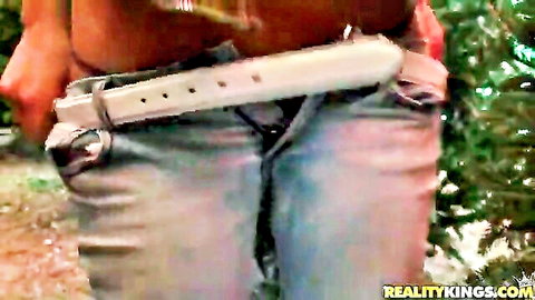 Dark-haired MILF exposes pussy in undone jeans outdoors for cash