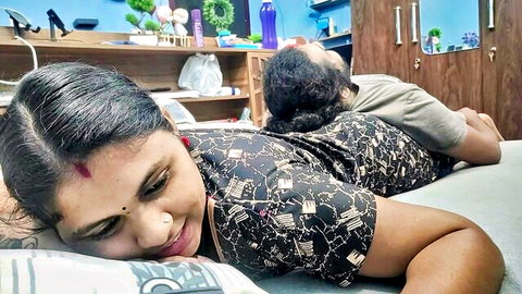 Mature Indian stepmom and stepson cuddling intimately on bed