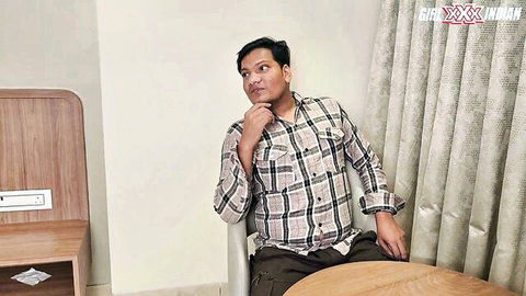 Indian man in checkered shirt seated thoughtfully in cougar sex teaser