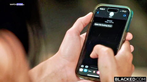 Queenie Sateen holding phone with mysterious 'Open the trunk' text in Blacked scene