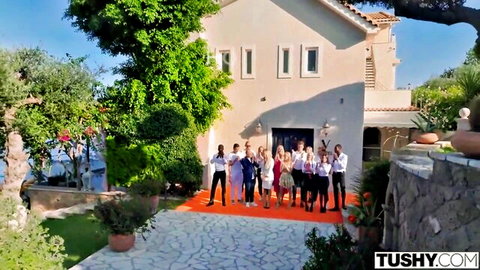 Tushy.com cast posing on red carpet at luxury Mediterranean villa
