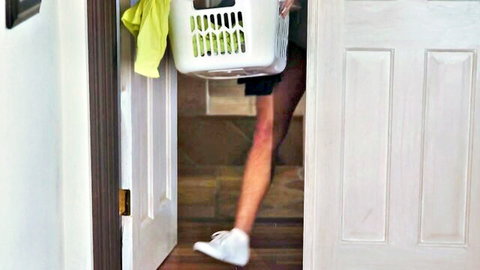 Bella Rolland in shorts carrying laundry basket, sexy legs doorway tease