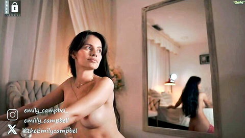 Emily Campbell busty topless in erotic cam video, seductive mirror pose