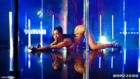 Ebony babe in fishnets and high heels spreads bare ass on strip club floor