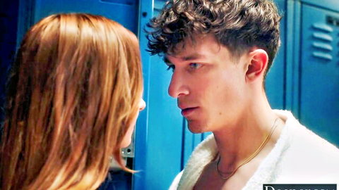 Redhead babe stares intensely at curly-haired guy in locker room robe