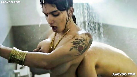 Wet tattooed Indian babe with huge tits moans mouth open as naked man fucks her from behind in shower