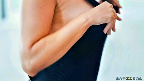 Eve Sweet teases by pulling down black top exposing perky breasts
