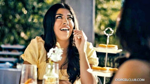 Jasmine Sherni and Vicki Chase smiling in yellow dresses outdoors