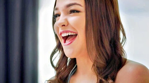 Rissa May smiling teen beauty with wavy brown hair