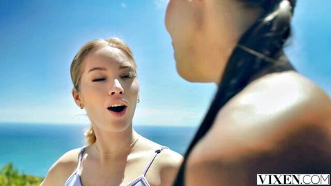 Skinny blonde with small tits opens mouth wide moaning at long-haired brunette by ocean beach
