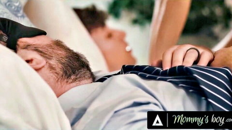 MILF stepmom gropes sleeping stepson's cock bulge in bed