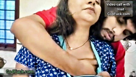 Indian MILF in passionate rear embrace with bearded lover, showing deep cleavage
