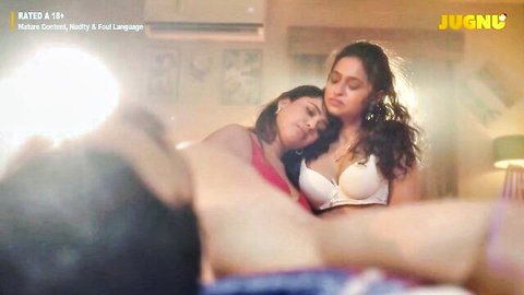 Two curvy Indian women in lingerie cuddling intimately