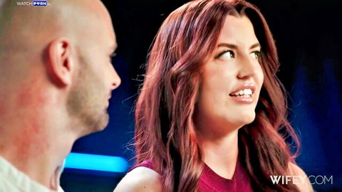 Redhead wife smiling seductively at bald man in closeup tease