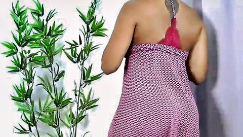 Suzy Anderson seductive back view in pink lingerie and patterned wrap