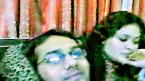Sweet plump Pakistani couple cuddling intimately on webcam