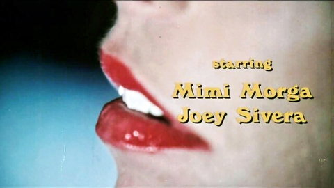 Vintage close-up of Mimi Morgara's red lips in 1978 porn The First Time