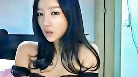 Cute Korean brunette teases with hot curves in off-shoulder top