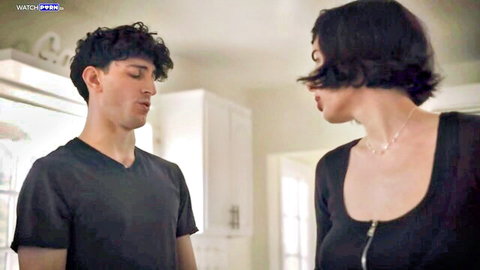 Olive Glass in tense close-up with curly-haired young man, MissaX stepmom scene