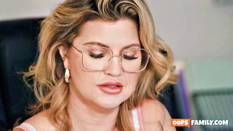Andie Anderson blonde in glasses, pouty lips and pink top cleavage