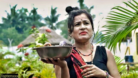 Sara019 in traditional red saree holding puja thali outdoors, sultry Indian desi vibe
