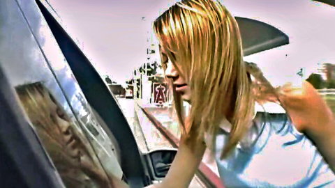 Ashlynn Brooke blonde in seductive car window pose, outdoor tease