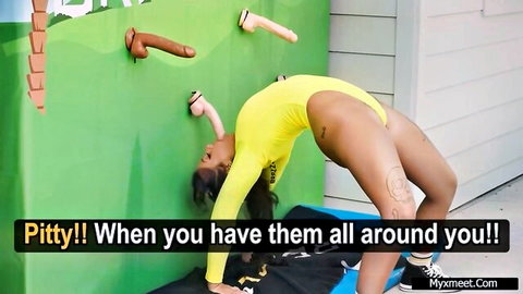 Ebony flexible gymnast in yellow bodysuit arches near wall dildos, Brazzers House