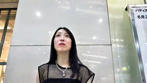 Asian MILF in sheer black mesh top revealing bra and huge cleavage in spa lobby