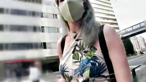 Mature Japanese woman with gray hair in floral halter dress, outdoor walk tease