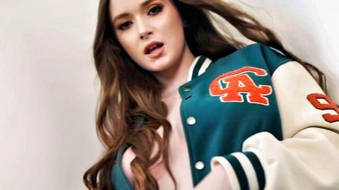Hazel Moore teases in open varsity jacket showing cleavage