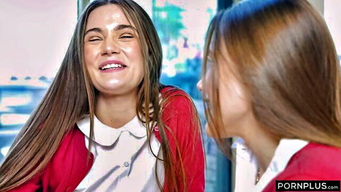 Juniper Ren and Rose Carter as twins teasing in red cardigans and white shirts, smiling playfully