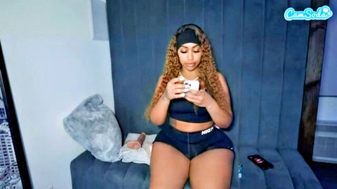 Curvy ebony babe in tight PUMA sports bra and shorts on webcam