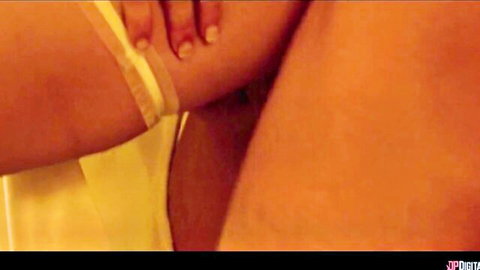 Closeup of sexy babe's toned arm in yellow lingerie gripping passionately