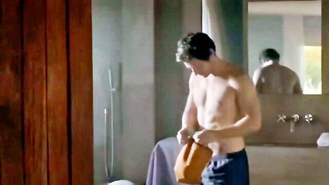 Shirtless Latin hunk in underwear, bathroom mirror pose with towel