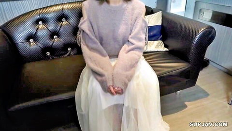 Shiho high school student in fuzzy pink sweater and tulle skirt
