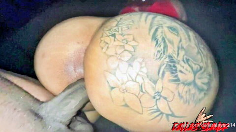Tattooed Asian woman with floral and lion butt tattoos in doggy style penetration