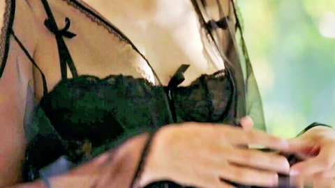 Mona Wales in sheer black lace lingerie with bows, teasing cleavage