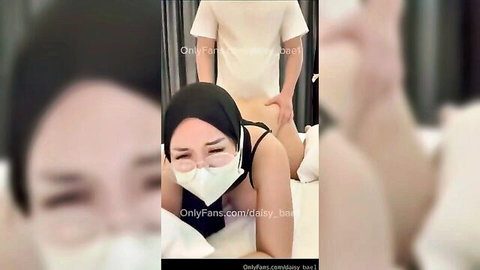 Daisy Bae in hijab and mask, white lingerie, bent over teasing from behind