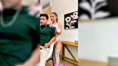 Beautiful brunette in sexy white lingerie embraces Latino man