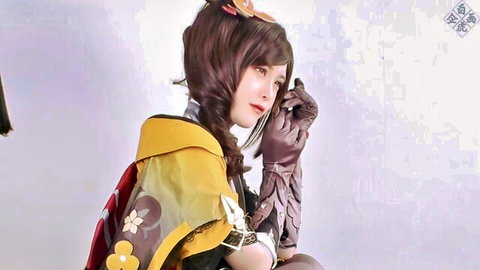 Sexy Japanese cosplay babe in sheer yellow top and leather gloves posing seductively