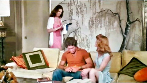 Vintage brunette MILF watches redhead teen flirt with hunk fiddling crotch on couch
